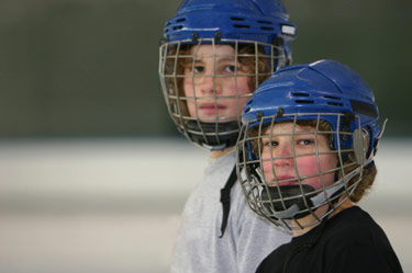 Hockey Players Outdoors - Why We Coach Youth Hockey